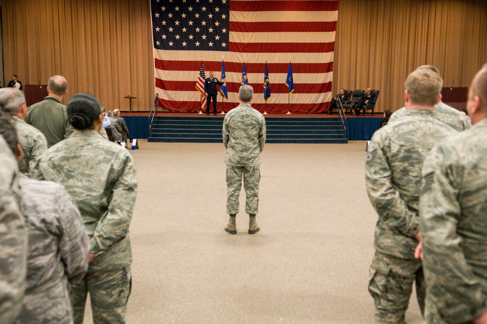 Members of the 307th Bomb Wing listen as their new commander, Col. Bruce Cox, speak during a Change of Command Ceremony, Dec. 7, 2014, Barksdale Air Force Base, La. Cox, is the former Director of Operations and Plans Directorate, 10th Air Force, Naval Air Station Joint Reserve Base Fort Worth, Texas. (U.S. Air Force photo by Master Sgt. Greg Steele/Released)