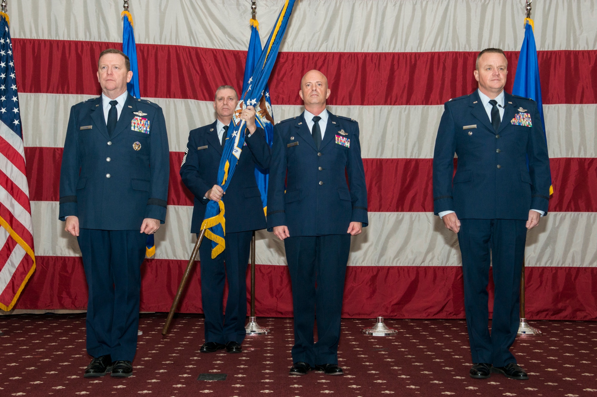 U.S. Air Force Brig. Gen. Richard Scobee (left), 10th Air Force commander, presides over the 307th Bomb Wing Change of Command Ceremony, Dec. 7, 2014, Barksdale Air Force Base, La. During the ceremony, Col. Jonathan Ellis (center) relinquished of the wing to Col. Bruce Cox (right). (U.S. Air Force photo by Master Sgt. Greg Steele/Released)