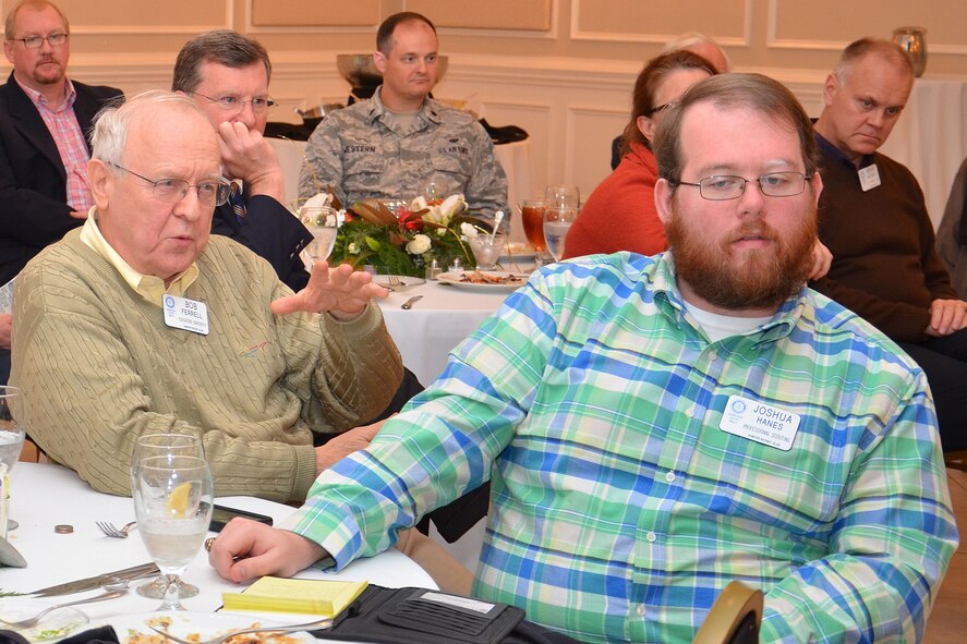 Bob Ferrell, Sumter Rotarian, asks U.S. Air Force Maj. Gen. H.D. Polumbo Jr., Ninth Air Force commander, a question during the Rotary Club meeting in Sumter, S.C., Dec. 8, 2014. Ferrell, a history professor at the University of South Carolina, is one of more than 84 Sumter Rotarians who donates his time and talent to serve the community of people in South Carolina.  (U.S. Air Force photo by Master Sgt. Latisha Cole/Released)
