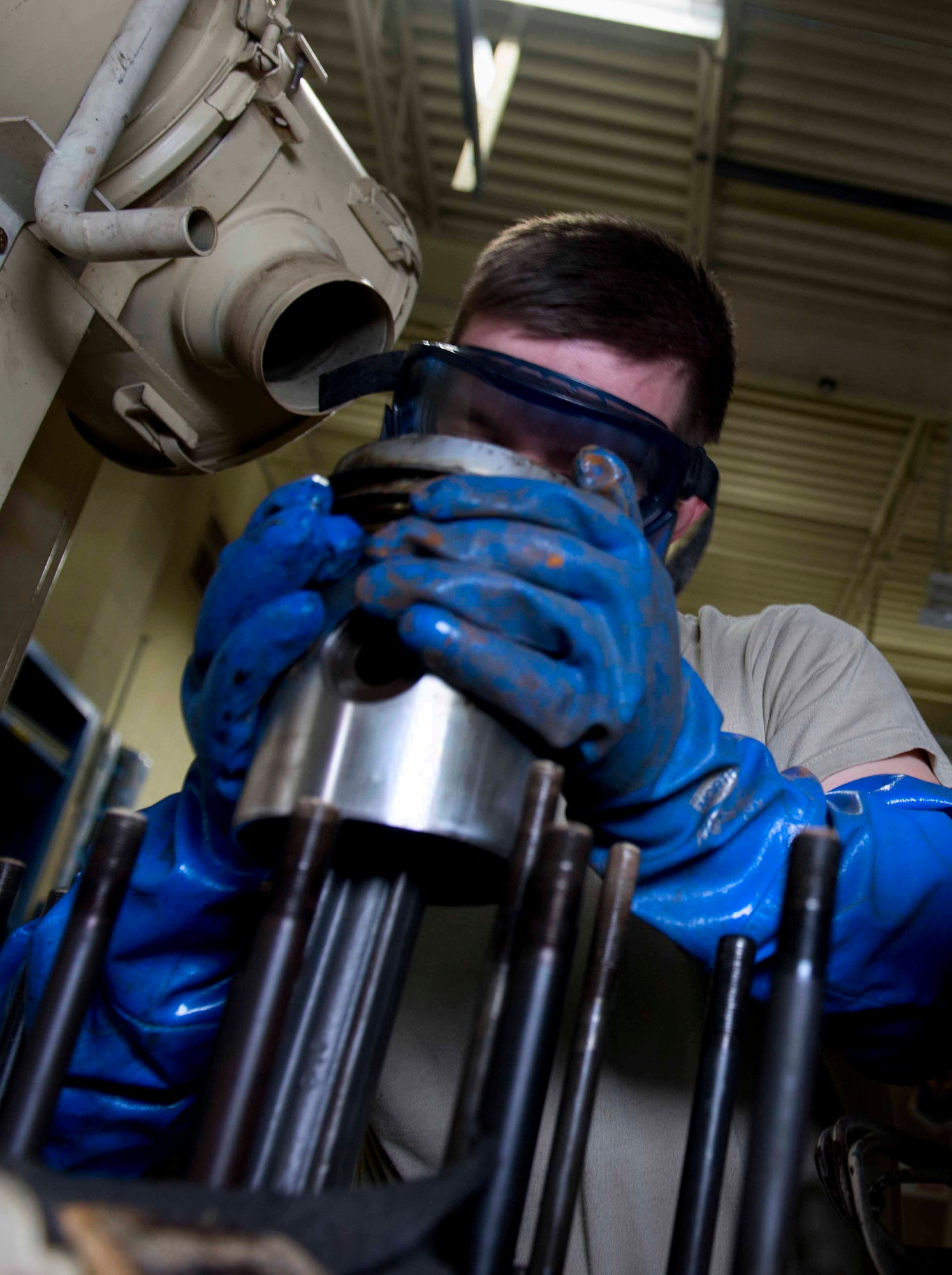 Airman 1st Class Patrick Mako, 91st Missile Maintenance Squadron facilities maintenance section technician, pulls a piston off of a diesel generator on Minot Air Force Base. N.D., Nov. 25, 2014. Diesel generators are used to provide power to a site whenever commercial power is offline. (U.S. Air Force photo/Airman 1st Class Sahara L. Fales)