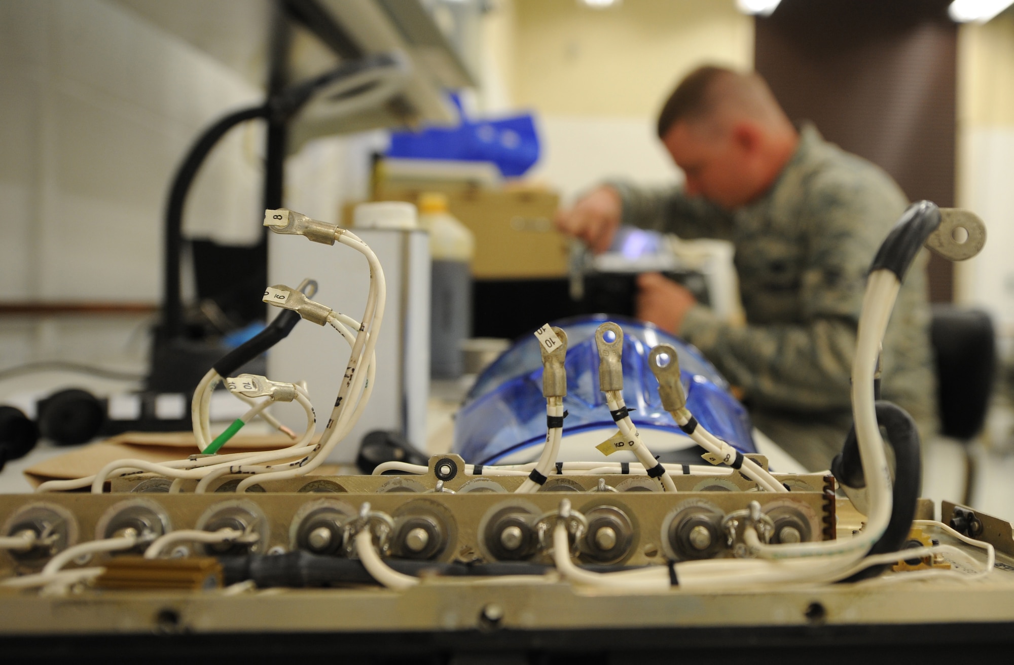 Senior Airman Colby Nash, 509th Maintenance Squadron electrical and environmental systems technician, works on a broken transformer rectifier from a B-2 Spirit, Nov. 25, 2014, at Whiteman Air Force Base, Mo. The shop was able to resolve issues of broken transformer rectifiers that could have possibly brought the shop and other maintenance personnel to a halt. (U.S. Air Force photo by Staff Sgt. Alexandra M. Boutte/Released)
