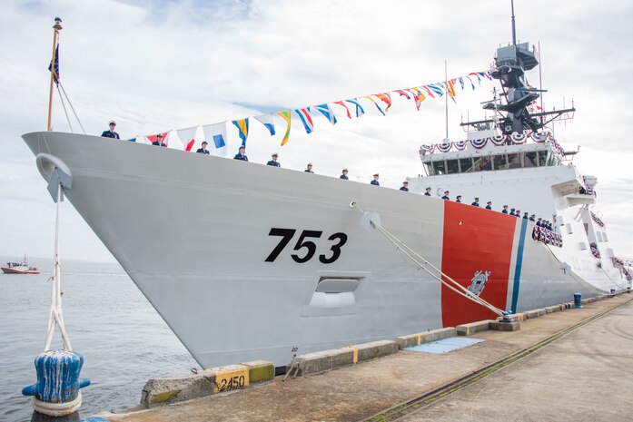 The crew of Coast Guard Cutter Hamilton take up positions around the deck of the cutter after the vessel's commissioning ceremony in Charleston, Dec. 6, 2014. Hamilton is the Coast Guard’s fourth 418-foot Legend-Class National Security Cutter. (Coast Guard photo by Petty Officer 1st Class Stephen Lehmann)