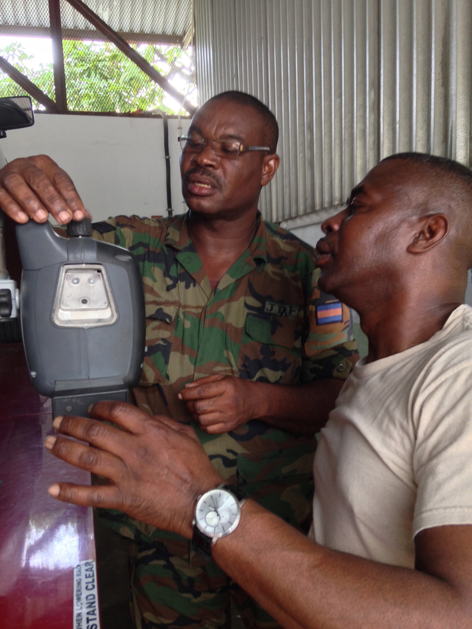 Jamaica Defence Force Sgt. Rodgers G. (left) and U.S. Army Master Sgt. Jesse Evans (right) fix a JDF truck on the second day of a weeklong subject matter expert exchange. Expert vehicle mechanic soldiers and airmen from the D.C. National Guard are here to share best practices with their JDF counterparts National Guard Bureau’s State Partnership Program. Rodgers G. is a vehicle mechanic and Evans is a D.C. Army National Guard surface maintenance inspector supervisor. (U.S. Air National Guard photo by Capt. Renee Lee)