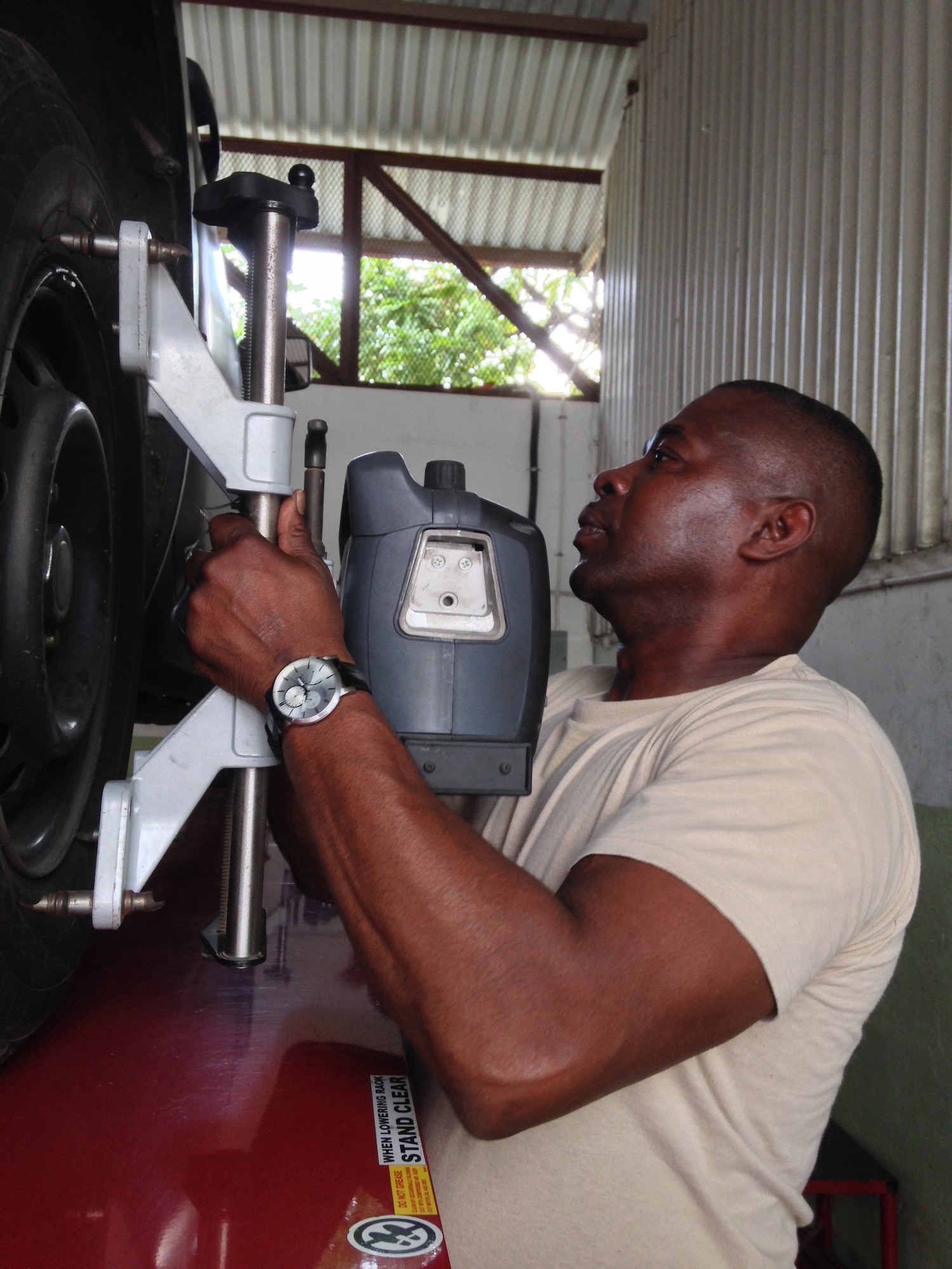 Master Sgt. Jesse Evans fixes a JDF truck on the second day of a weeklong subject matter expert exchange. Expert vehicle mechanic soldiers and airmen from the D.C. National Guard are here to share best practices with their JDF counterparts National Guard Bureau’s State Partnership Program. Evans is a D.C. Army National Guard surface maintenance inspector supervisor. (U.S. Air National Guard photo by Capt. Renee Lee)