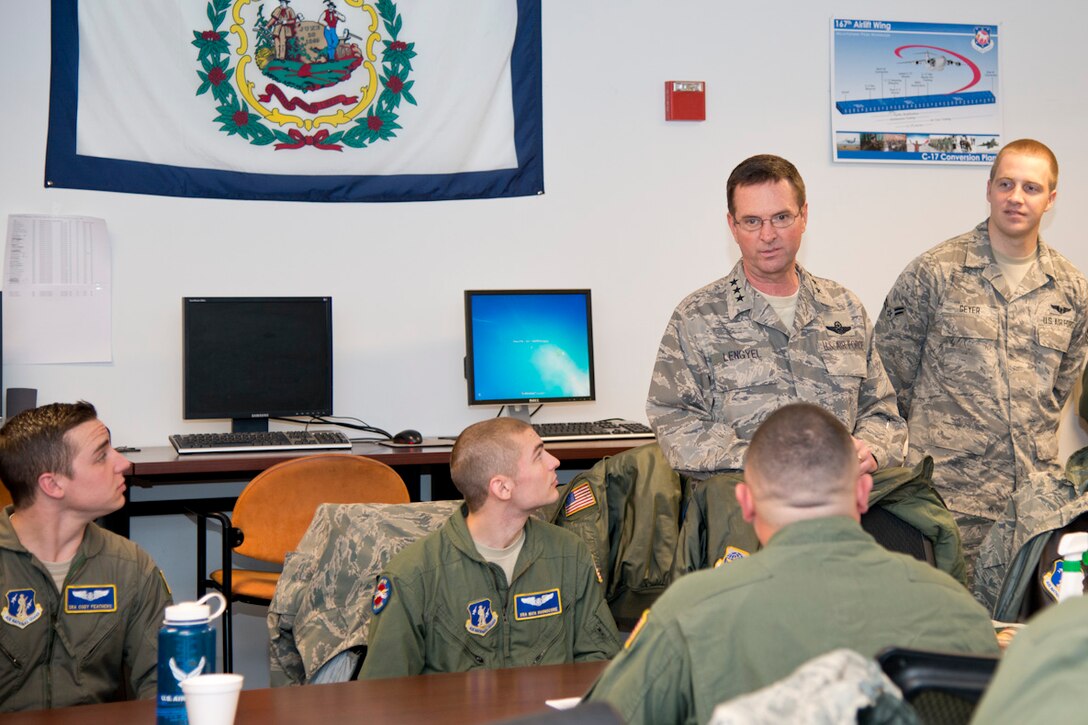 Lt. Gen. Joseph L. Lengyel, vice chief of the National Guard Bureau in Washington, D.C., attended the C-17 Globemaster III conversion ceremony at the 167th Airlift Wing in Martinsburg, W.Va., Dec. 6, 2014. Lengyel visited unit members and recognized some for their hard work by presenting them with his coin. He also shared stories from his career in the Air National Guard and thanked members for their service. (Air National Guard Photo by Staff Sgt. Jodie Witmer/Released)