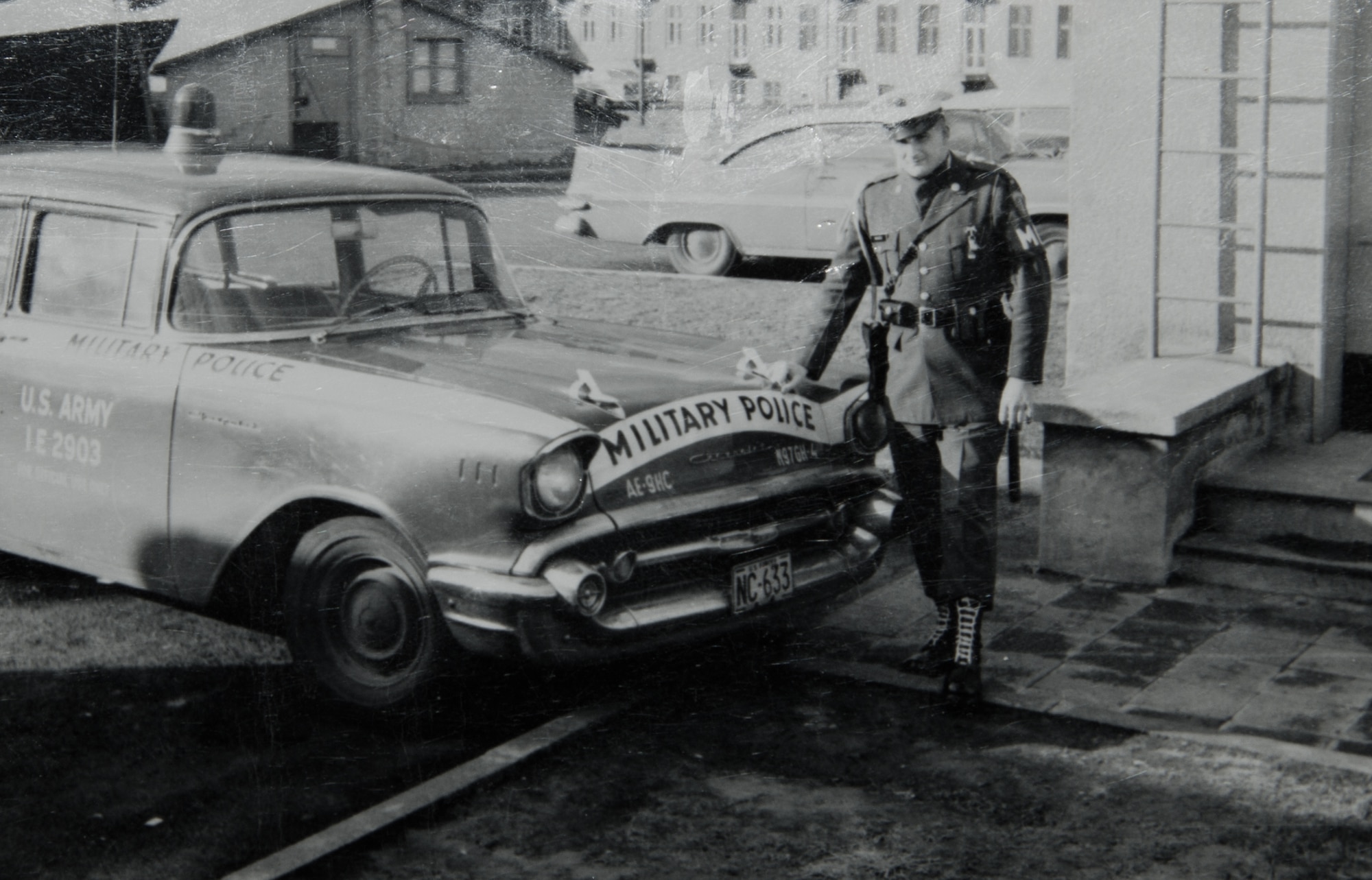 John Mace stands next a military police vehicle during his time in the Army. After serving 25 years in the Army and Air Force, Mace continued his career in civil service for another 29 years. Mace is scheduled to retire, Dec. 12, 2014 after being a part of the military for 54 years. (Courtesy photo) 