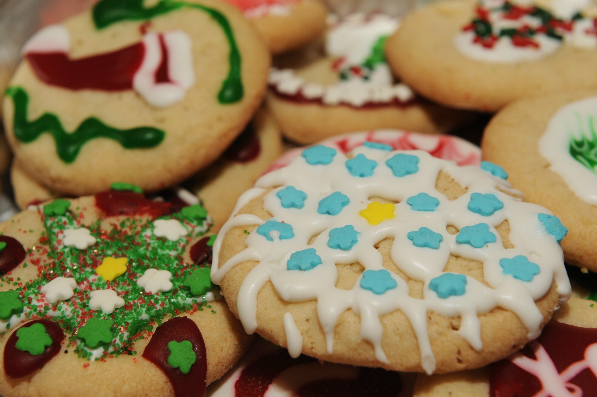 Holiday cookies baked by volunteers sit on a plate at the Rocker NCO Club on Kadena Air Base, Japan, Dec. 9, 2014. More than 31,500 cookies were collected for the annual holiday cookie drive over a two day period and packaged into boxes of 12, which were then delivered to approximately 2,100 Airmen, soldiers, sailors and Marines living in dormitories on Kadena. (U.S. Air Force photo by Airman 1st Class Zade C. Vadnais/Released) 