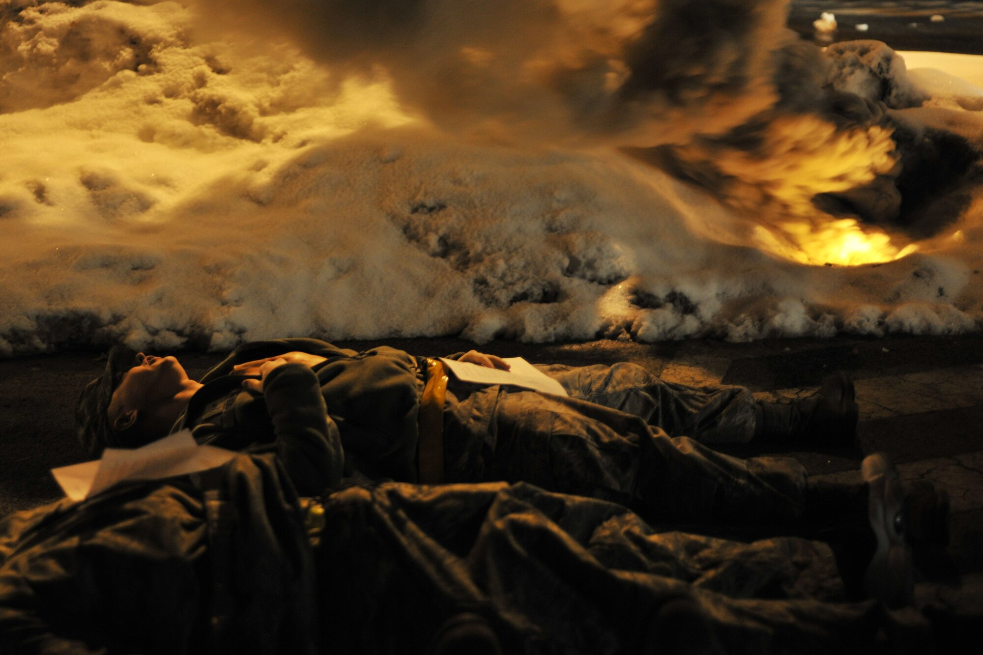 Simulated casualties wait to be treated after indirect fire during Exercise Beverly Bulldog 15-1 at Kunsan Air Base, Republic of Korea, Dec. 7, 2014. The eight-day exercise in the austere environment tested the Wolf Pack’s ability to respond to wartime and armistice threats. (U.S. Air Force photo by Senior Airman Katrina Heikkinen/Released) 