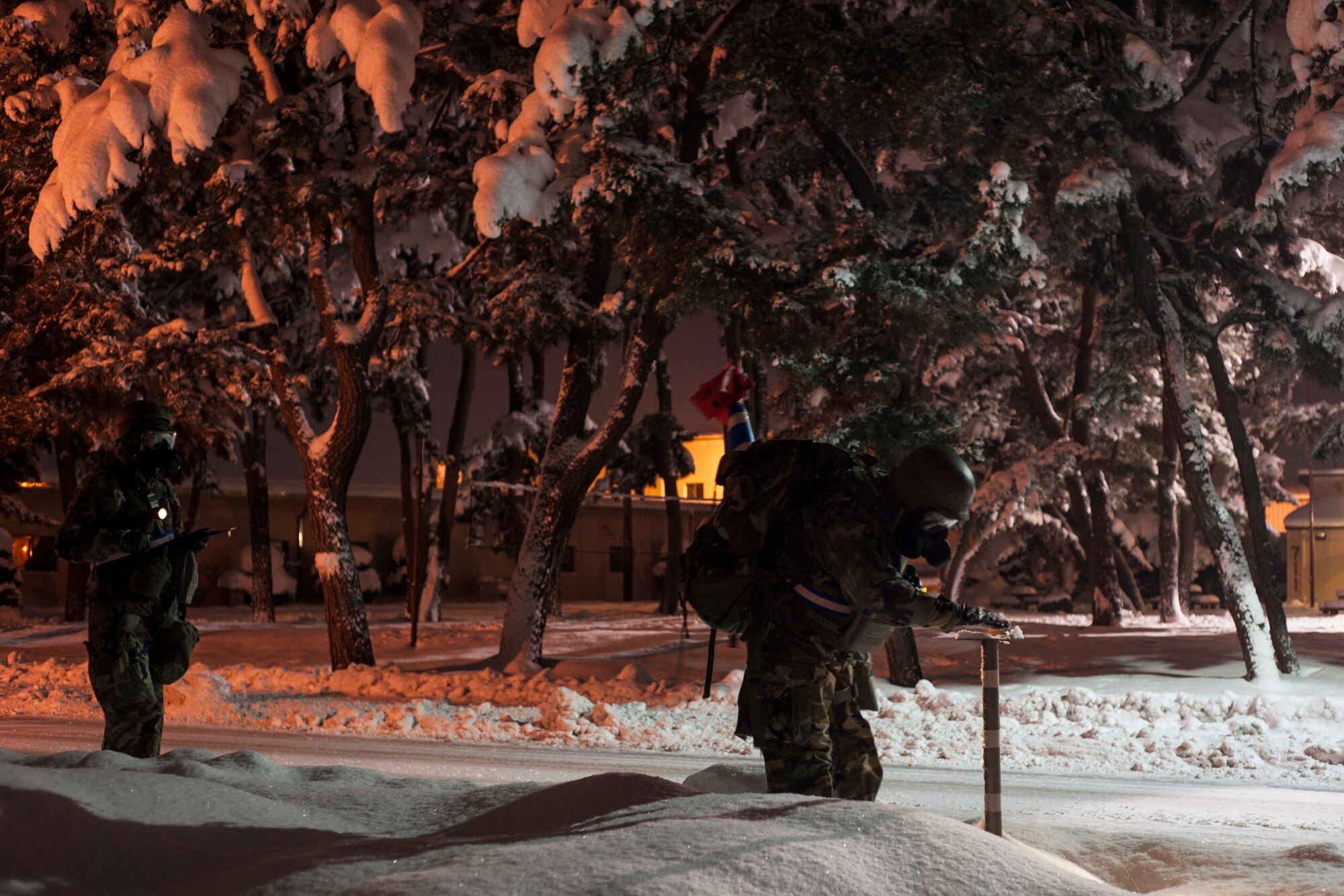 U.S. Air Force Airmen from the 8th Comptroller Squadron conduct a post attack reconnaissance sweep after a simulated ground attack during Exercise Beverly Bulldog 15-1 at Kunsan Air Base, Republic of Korea, Dec. 6, 2014. The eight-day exercise took place in an austere environment that tested the Wolf Pack’s ability to respond to wartime and armistice conditions. (U.S. Air Force photo by Senior Airman Katrina Heikkinen/Released)