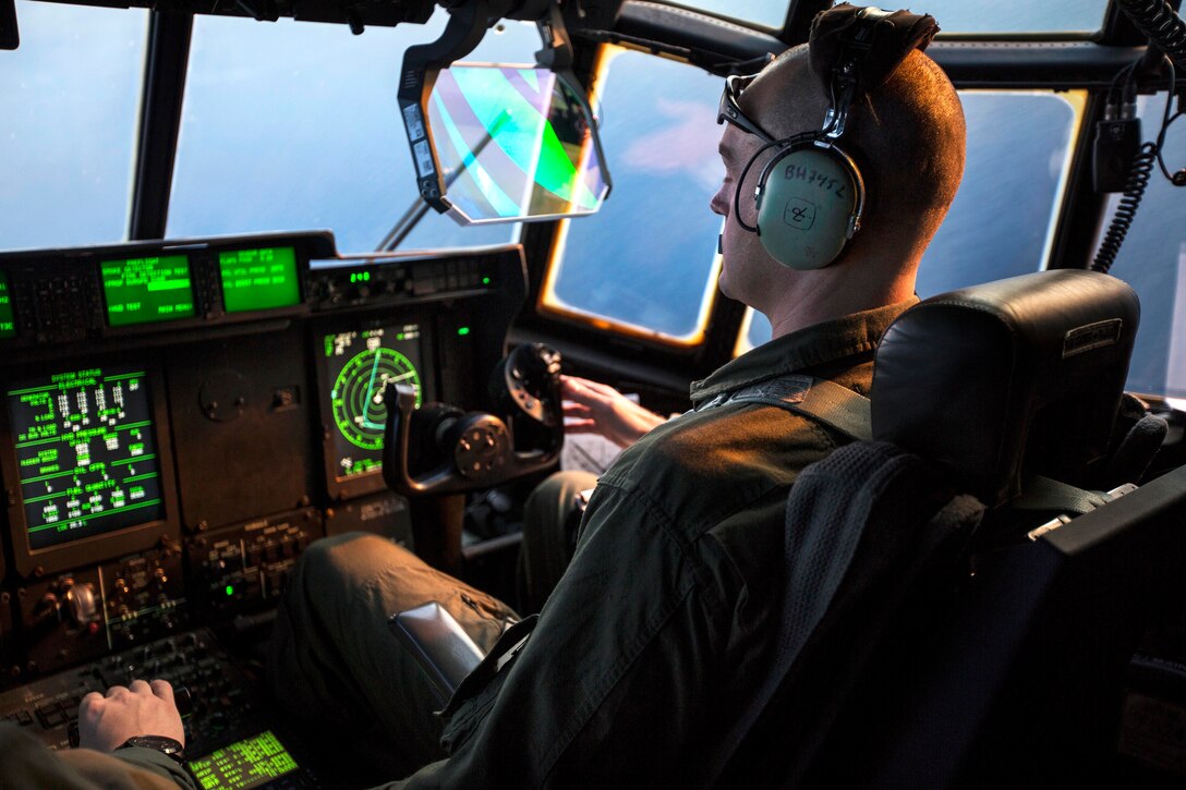 Marine Corps Cpt. Brian A. Hart maneuvers a KC-130J Super Hercules aircraft during an aerial refueling exercise on Marine Corps Air Station Cherry Point, N.C., Dec. 3, 2014. Hart is a pilot assigned to Marine Aerial Refueler Transport Squadron 252.