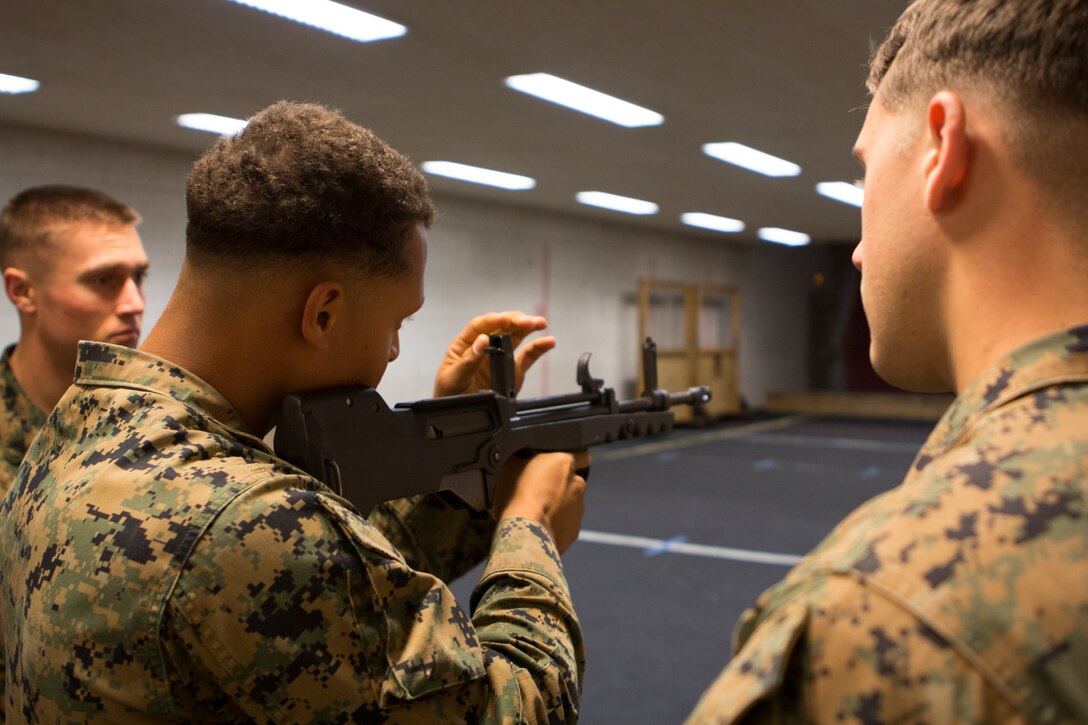A U.S. Marine with SPMAGTF Crisis Response – Africa adjusts the sights of a French FAMAS rifle at the National Gendarmerie Training Center in St. Astier, France, Dec. 1, 2014.  The Marines were conducting crowd and riot control training with the French Gendarmerie, allowing the Marines to gain greater knowledge of non-lethal tactics, techniques and procedures while enhancing interoperability with the French Gendarmerie and strengthening the U.S. partnership with France.  (U.S. Marine Corps photo by Cpl. Jeraco Jenkins/Released)