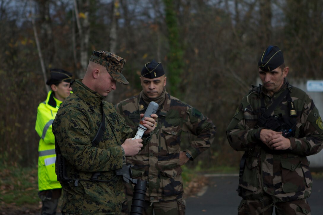 U.S. Marine Lance Cpl. Chase M. Graves, a grenadier with SPMAGTF Crisis Response – Africa, assembles a tear gas canister for a Cougar grenade launcher at the National Gendarmerie Training Center in St. Astier, France, Dec. 1, 2014.  The Marines were conducting crowd and riot control training with the French Gendarmerie, allowing the Marines to gain greater knowledge of non-lethal tactics, techniques and procedures while enhancing interoperability with the French Gendarmerie and strengthening the U.S. partnership with France.  (U.S. Marine Corps photo by Cpl. Jeraco Jenkins/Released).
