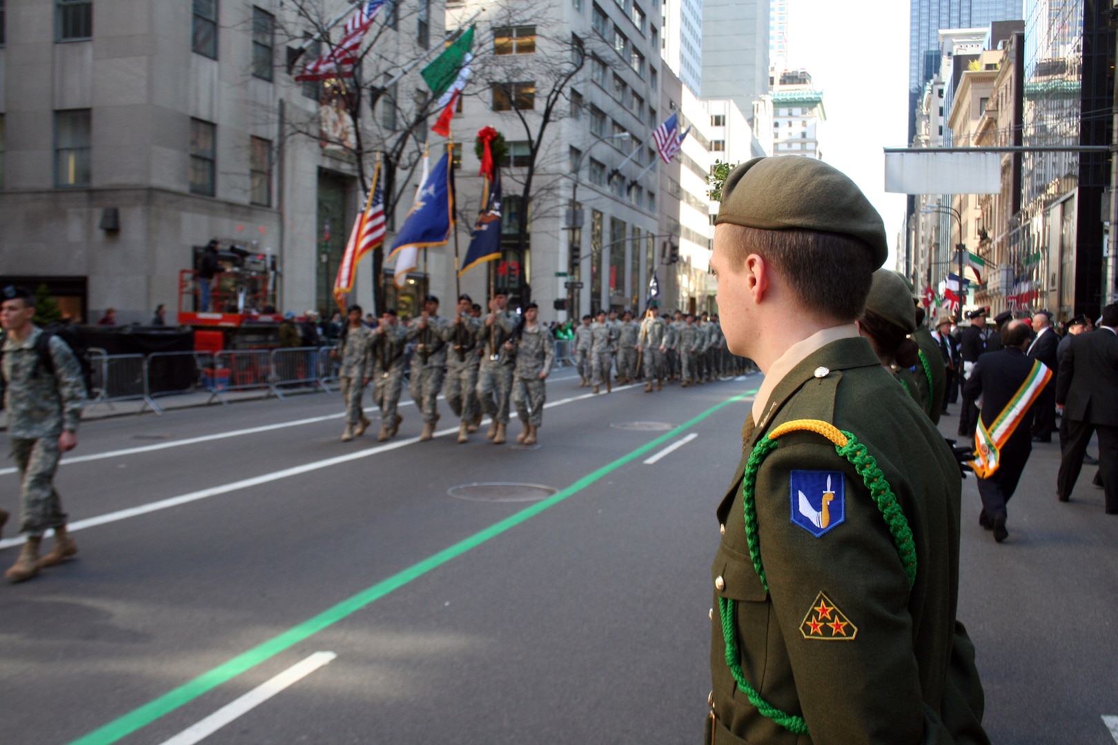 Members of the Irish Army's 58th Infantry Battalion render honors as Soldiers of the New York Army National Guard's 1st Battalion, 69th Infantry Regiment pass outside Saint Patrick's Cathedral during the annual march up Fifth Avenue in the world's largest St. Patrick's Day Parade in New York City on March 17. 2010.
