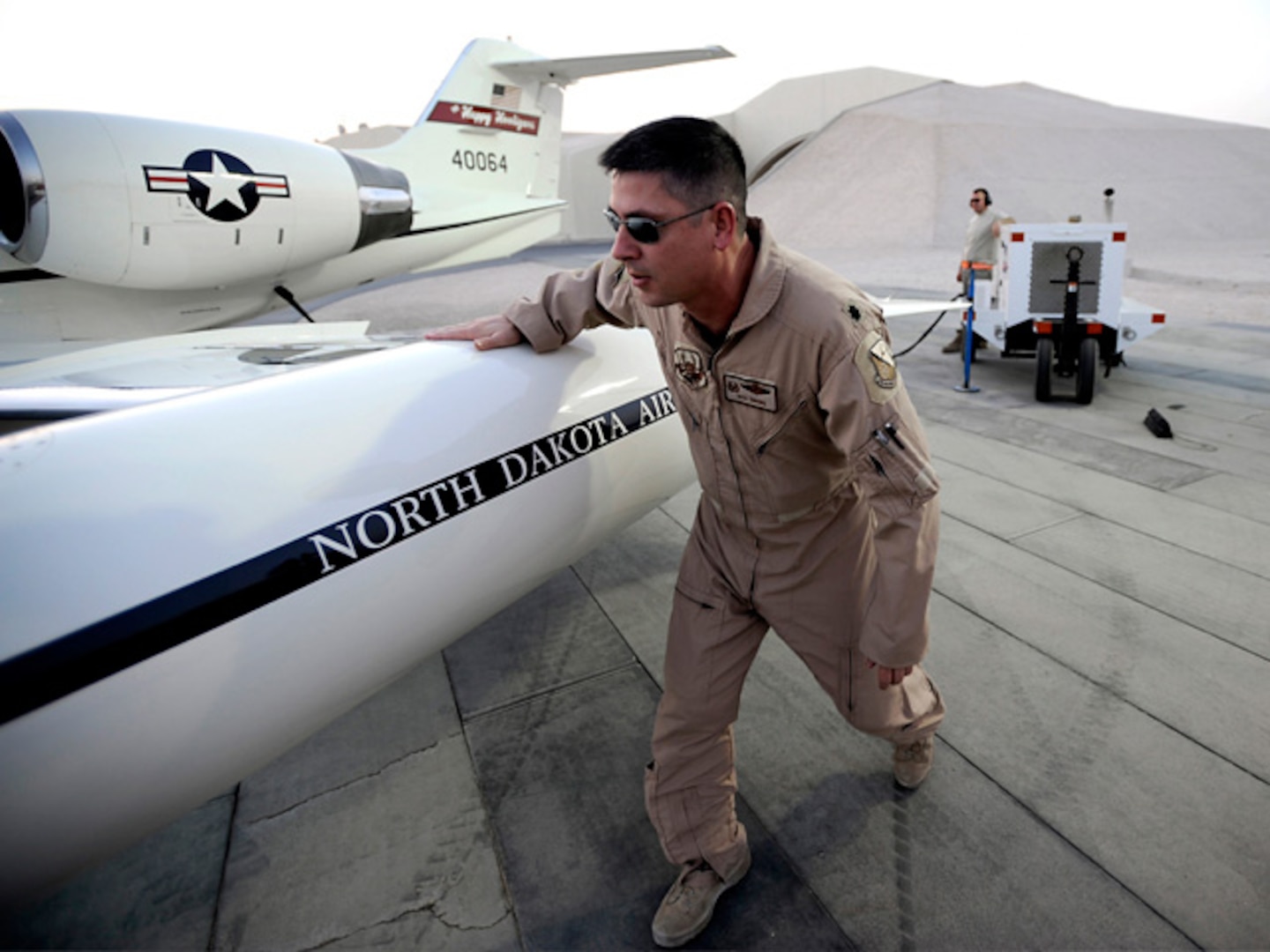 Lt. Col. Rick Omang, commander of the 178th Airlift Squadron of the North
Dakota Air National Guard, performs a preflight inspection before conducting combat operations while deployed in Southwest Asia July 26, 2009.