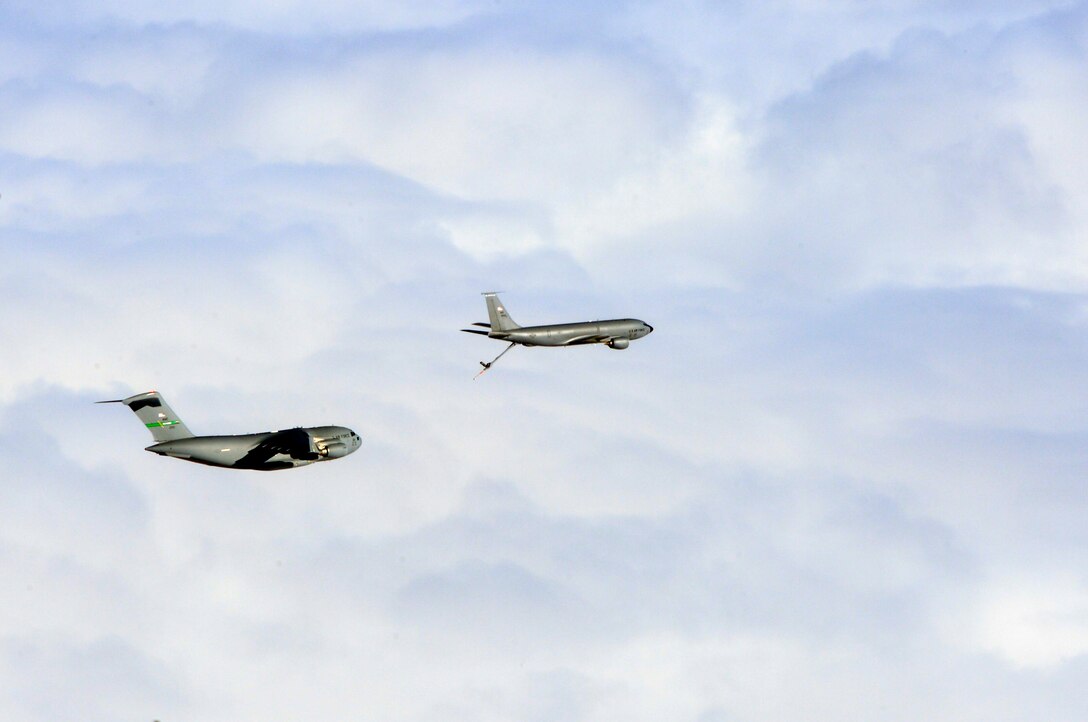 A Joint Base Lewis-McChord C-17 Globemaster III prepares to perform aerial refueling with a KC-135 Stratotanker aircraft from Fairchild Air Force Base’s 92nd Air Refueling Wing Dec. 6, 2014, before a joint forcible entry exercise near the Keno drop zone, Nev. The McChord aircrews conducted two elements of two-on-two air refueling with the KC-135 aircrafts before participating in the JFE. (U.S. Air Force photo/Staff Sgt. Russ Jackson)