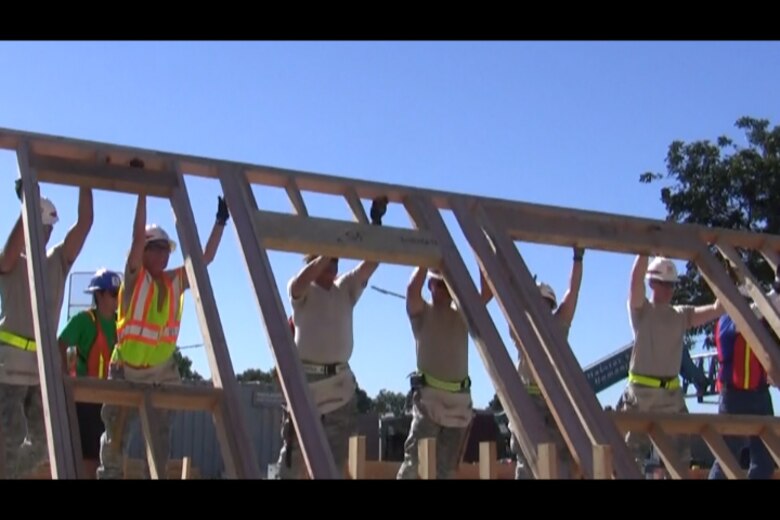 Active duty military from the Corps' Los Angeles District help Habitat for Humanity of Orange County raise a wall during construction of townhomes in Cypress. The effort was part of an outreach organized by District Commander Col. Kim Colloton to support the communjity and  military veterans.