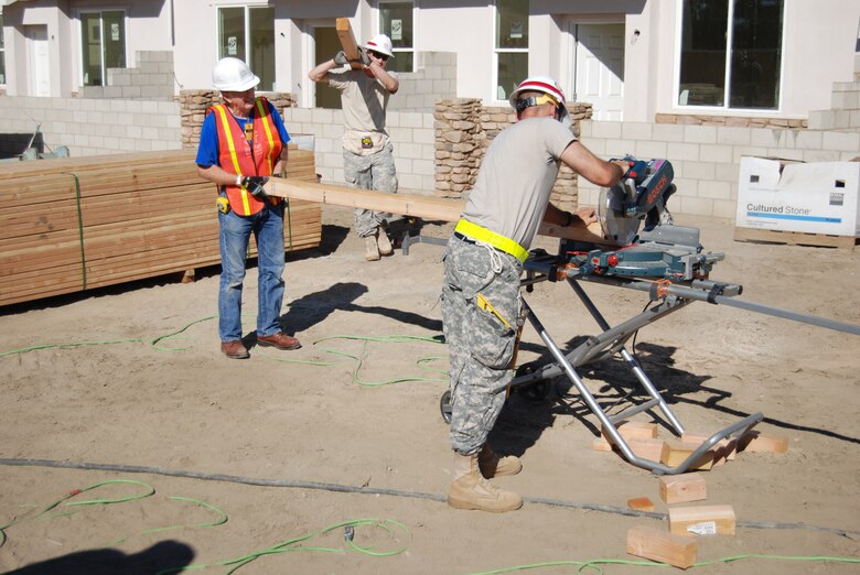 Soldiers from the Corps' Los Angeles District assist Habitat for Humanity of Orange County construct townhomes in Cypress during a community outreach activity coordinated by District Commander Col. Kim Colloton. The activity conducted just prior to Veterans Day will provide homes for 15 families, including two units dedicated for military veterans.