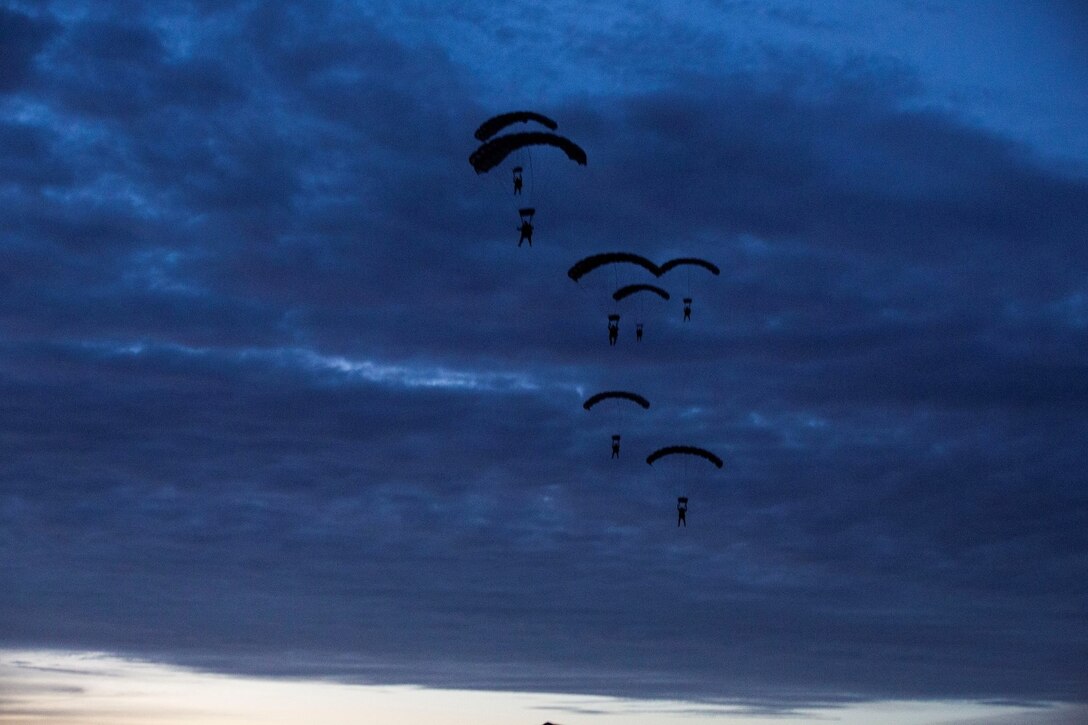 U.S. Marines with the Force Reconnaissance Detachment, 15th Marine Expeditionary Unit, conduct a static-line jump from an MV-22B Osprey during realistic urban training aboard Fort Hunter Liggett, Calif., Dec. 9, 2014. These Marines are part of the 15th MEU’s Maritime Raid Force. The purpose of RUT is to provide the MEU an opportunity to conduct training in unfamiliar environments in preparation for their upcoming deployment. (U.S. Marine Corps photo by Cpl. Anna Albrecht/Released)