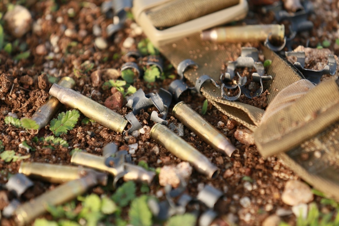 Expended rounds from a squad automatic weapon cover the ground during a realistic urban training exercise aboard Camp Roberts, Calif., Dec. 9, 2014.  RUT prepares the 15th Marine Expeditionary Unit's Marines for their upcoming deployment, enhancing their combat skills in environments similar to those they may find in future missions. (U.S. Marine Corps photo by Sgt. Jamean Berry/Released)