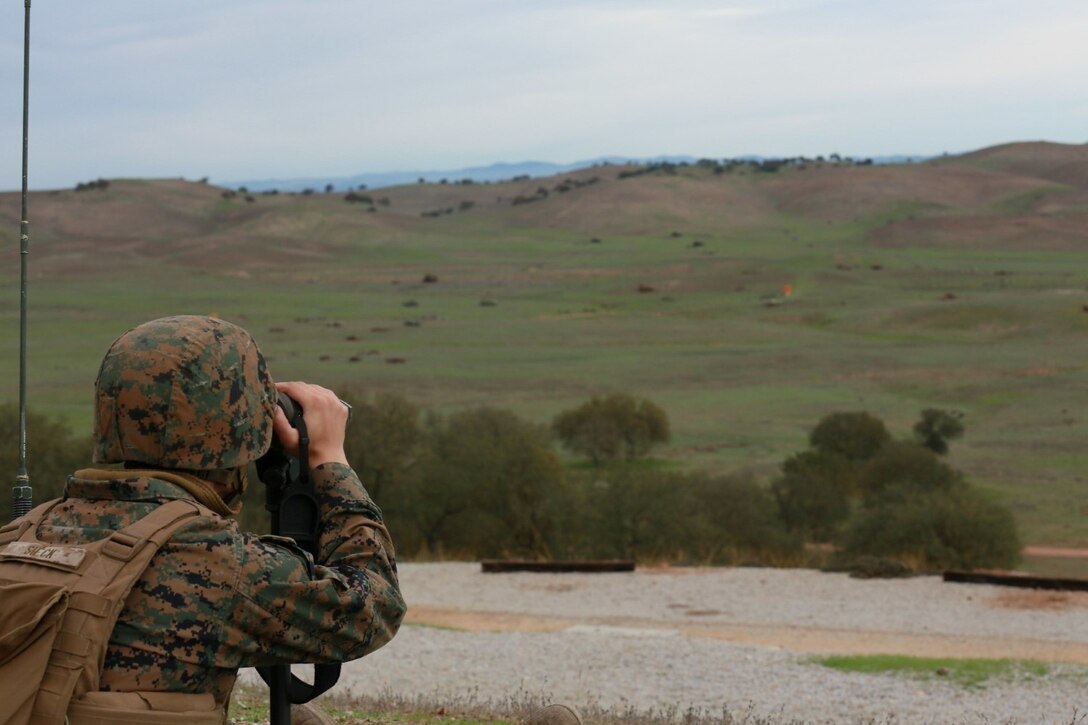 U.S. Marine forward observers with Battalion Landing Team 3rd Battalion, 1st Marine Regiment, 15th Marine Expeditionary Unit coordinate air and indirect fire during a realistic urban training exercise aboard Camp Roberts, Calif., Dec. 9, 2014.  RUT prepares the 15th Marine Expeditionary Unit's Marines for their upcoming deployment, enhancing their combat skills in environments similar to those they may find in future missions. (U.S. Marine Corps photo by Sgt. Jamean Berry/Released)
