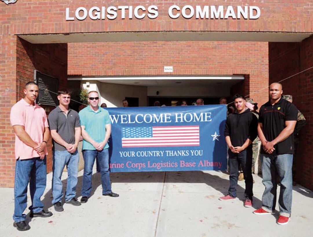 A team of Marine Corps Logistics Command Marines deployed to Afghanistan, April 19, for a six-month tour.  In the photo  (from left to right), Gunnery Sgt. Ryan Lowder, Capt. Patrick Semonelli, Gunnery Sgt. Anthony Logan, Cpl. Giovanni Lima and Sgt. Brandon Quarterman returned to a hero’s welcome, Dec. 3.