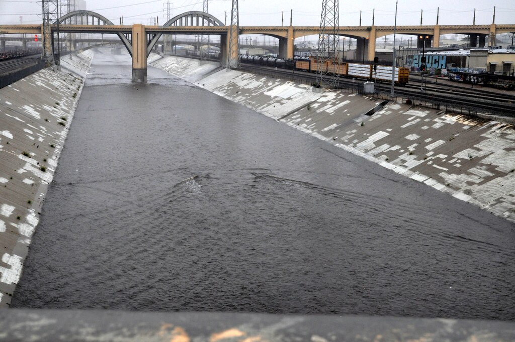 The LA River flows rapidly after passing under the 6th Street bridge at 1 p.m. Dec. 2, 2014. Other areas of the river are narrower and a lot deeper.