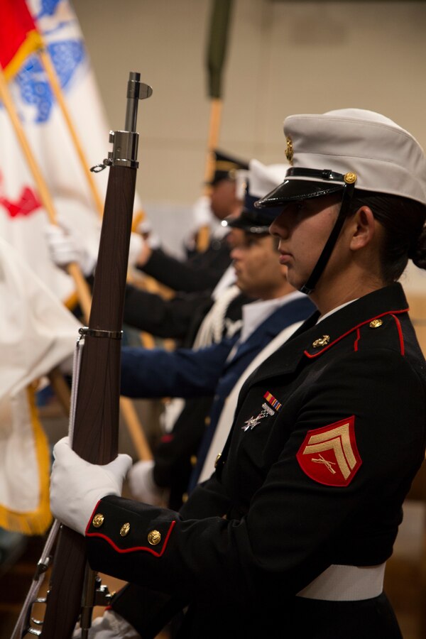 Members of a joint service color guard present the colors at the beginning of the City Council’s Military Appreciation Day at the New Orleans City Hall, Dec. 11, 2014. Military personnel from all services filled the council chamber to watch their senior leadership give presentations on the positive effect their commands have had on the community. (U.S. Marine Corps photo by Lance Cpl. Ian Leones/Released)