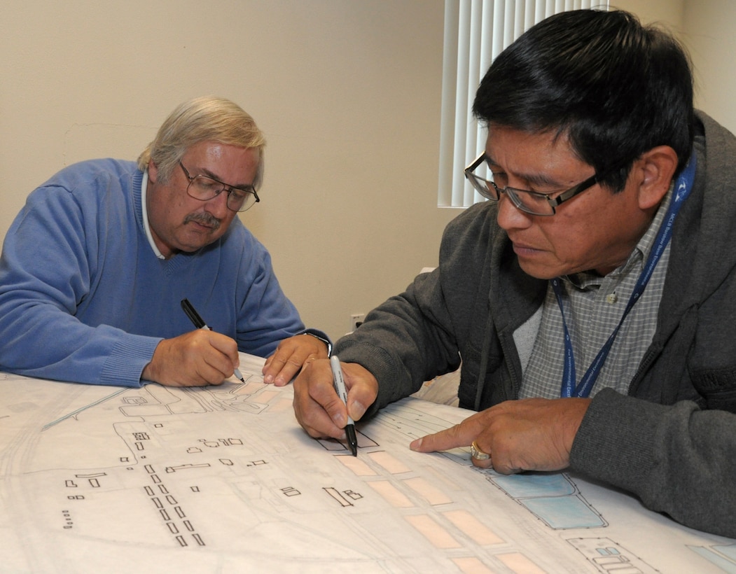 Jim Bustamante, Environmental Protection Specialist at MCLBB, (foreground), and GIS Manager MCLBB Rick Wiley work on a map for the visioning workshop.
