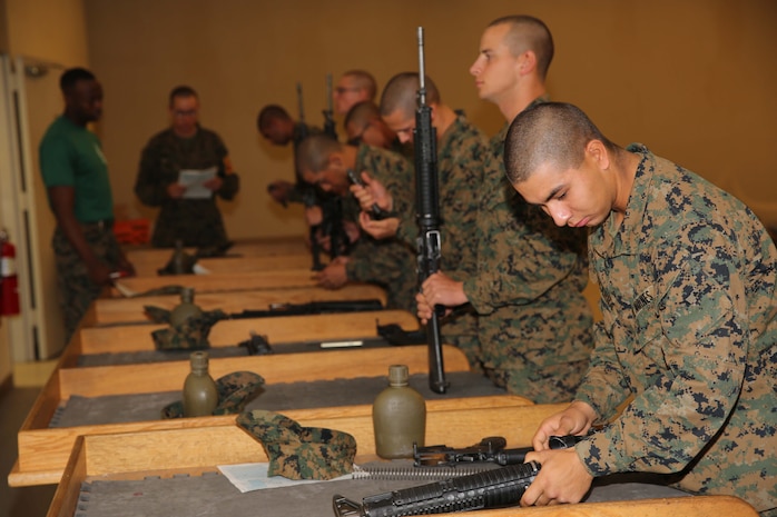 A recruit of Golf Company, 2nd Recruit Training Battalion, reassembles an M-16A4 Service Rifle at Marine Corps Recruit Depot San Diego, Calif., Dec. 2. Recruits are required to demonstrate their ability to disassemble and reassemble an M-16 A4 service rifle as a graduation requirement.