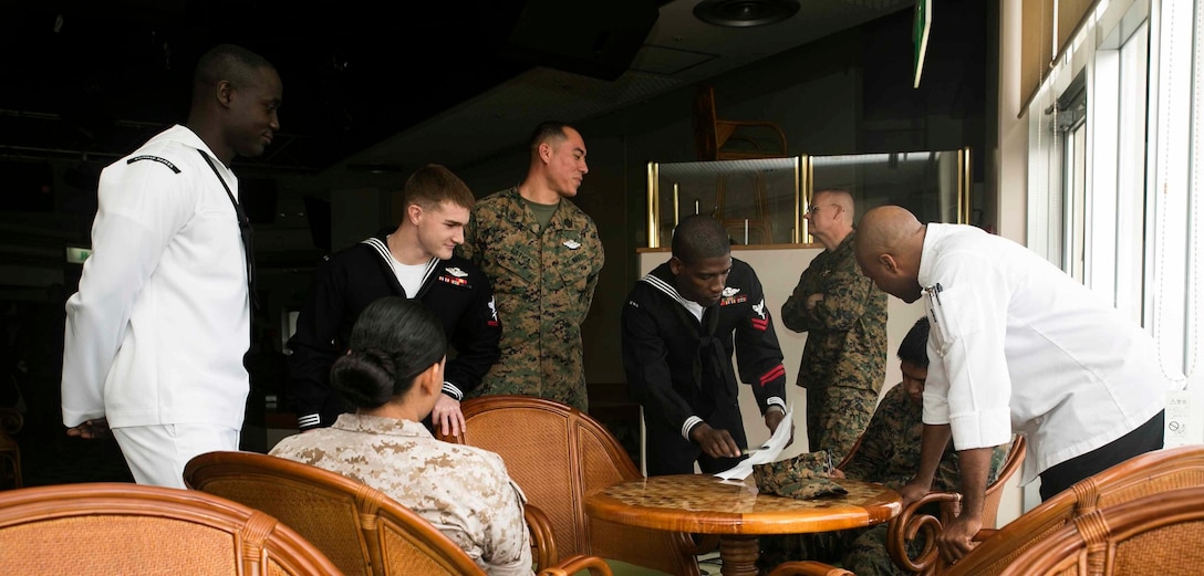 Marines and sailors gather to discuss their views on diversity Dec. 2 during Diversity Observance Day on Camp Hansen. The event participants were chosen based on their different backgrounds, and discussed what diversity meant to them. The event marked the first Diversity Observance Day held at III Marine Expeditionary Force, and it is planned to be an annual event, according to Master Gunnery Sgt. Rafika O. Vann, from Brooklyn, New York. Vann is the III MEF Equal Opportunity Adviser. 
