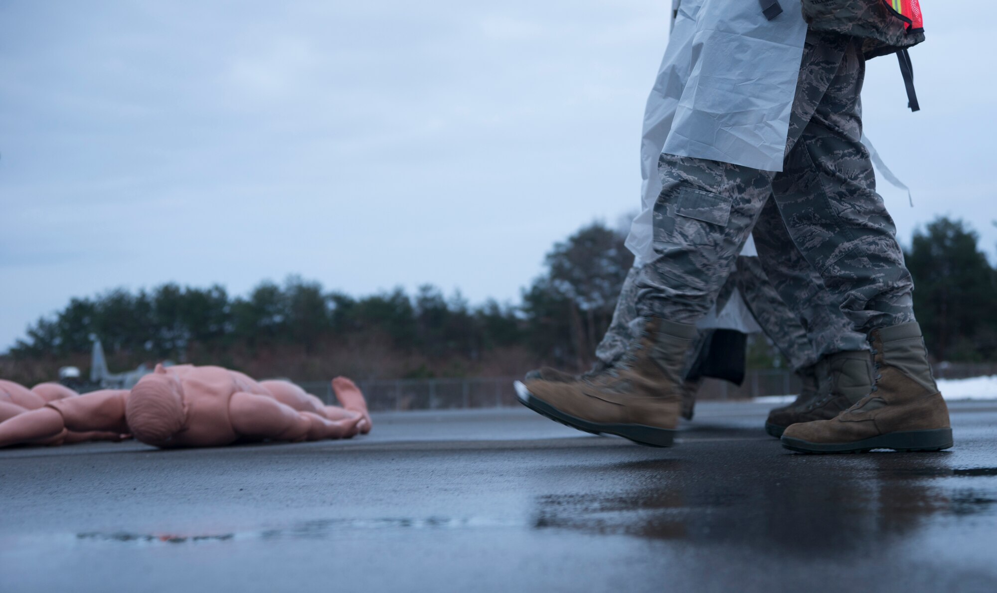 Airmen from the 35th Force Support Squadron perform a search and recovery sweep during exercise Beverly Sunrise 15-1 at Misawa Air Base, Japan, Dec. 10, 2014. After a simulated C-130 Hercules crashed on base, agencies including the 35th Civil Engineer Squadron’s fire department, 35th Medical Group and 35th Security Forces Squadron assembled on-scene initiate response procedures. (U.S. Air Force photo by Staff Sgt. Derek VanHorn/Released) 