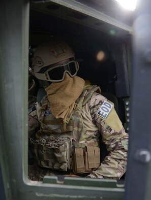 036-Airman 1st Class David Felkins, 366th Civil Engineering Squadron explosive ordinance disposal EOD apprentice, communicates with his team lead during training Dec. 10, 2014, at Mountain Home Air Force Base, Idaho. Previously equipment would be unloaded on and off an aircraft then reassembled, a process that took up to four hours. (U.S. Air Force photo by Airman 1st Class Malissa Lott/RELEASED)