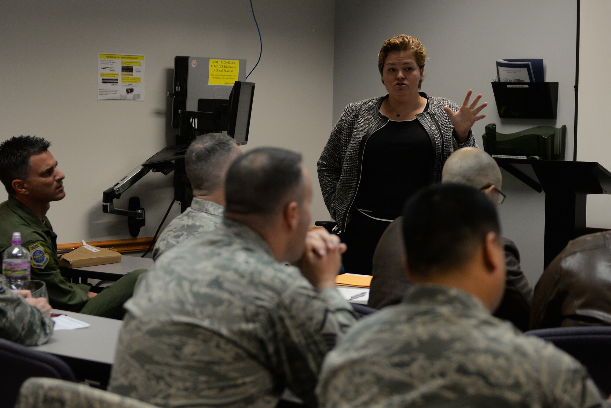Emily Siefkin briefs a room of servicemembers about the benefits of Troops to Teachers Dec. 4, 2014 at Scott Air Force Base, Ill. TTT is a program that assists individuals with transitioning from a military member to a teacher. Siefkin is the program manager for Troops to Teachers in the Illinois and Indiana program. (U.S. Air Force photo/ Airman 1st Class Kiana Brothers)