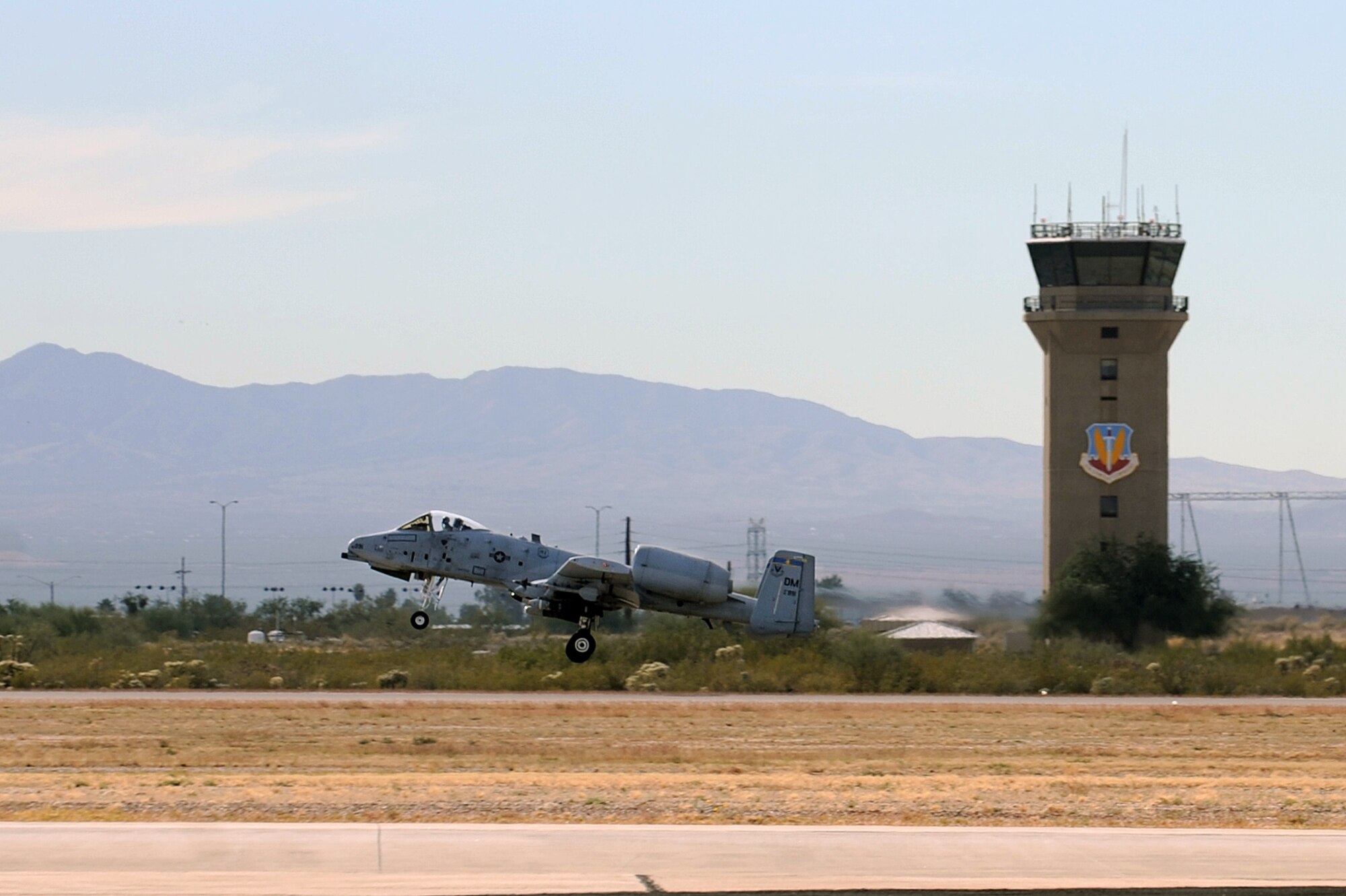 A U.S. Air Force A-10 Thunderbolt launches from the runway during an operational readiness exercise at Davis-Monthan Air Force Base, Ariz., Dec. 9, 2014. D-M’s Thunderbolts supported the combat search and rescue component of the exercise, performing both daytime and nighttime sorties. (U.S. Air Force photo by Airman 1st Class Chris Drzazgowski/Released) 