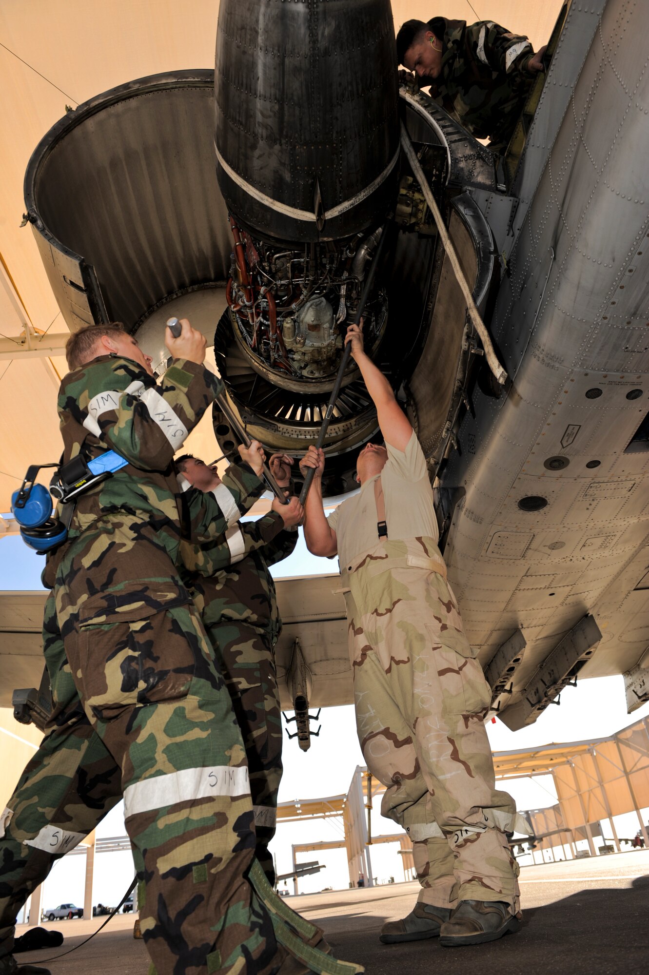 U.S. Air Force Airmen from the 354th Aircraft Maintenance Unit perform an engine swap on an A-10 Thunderbolt II during an operational readiness exercise at Davis-Monthan Air Force Base, Ariz., Dec. 10, 2014. Engine swaps are typically performed after the engine’s components safely receive the maximum amount of wear. (U.S. Air Force photo by Airman 1st Class Chris Drzazgowski/Released)