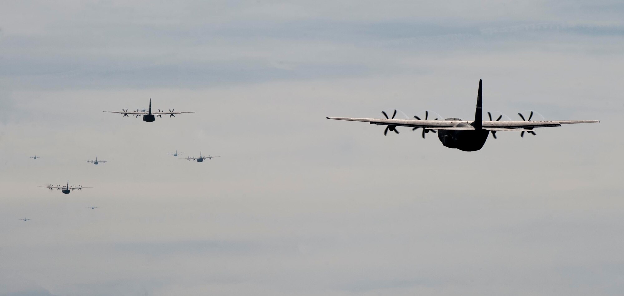 A group of C-130Js takes off Dec. 6, 2014, at Dyess Air Force Base, Texas. The C-130Js were part of a larger group of aircraft participating in a joint forcible entry exercise at Nellis Air Force Base, Nev. (U.S. Air Force photo by Airman 1st Class Alexander Guerrero/Released)