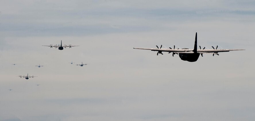 A group of C-130Js takes off Dec. 6, 2014, at Dyess Air Force Base, Texas. The C-130Js were part of a larger group of aircraft participating in a joint forcible entry exercise at Nellis Air Force Base, Nev. (U.S. Air Force photo by Airman 1st Class Alexander Guerrero/Released)