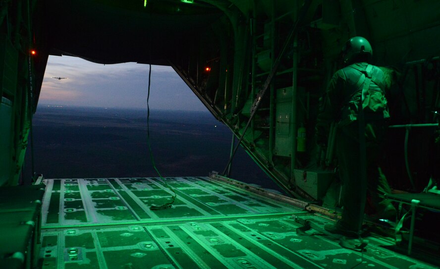 U.S. Air Force Elizabeth Patton, 317th Operation Support Squadron loadmaster, stands near the ramp of a C-130J Dec. 8, 2014, at Dyess Air Force Base, Texas. While returning from a joint forcible entry exercise at Nellis Air Force Base, Nev., the 317th Airlift Group used flight time as a training opportunity for pilots and loadmasters. (U.S. Air Force photo by Airman 1st Class Autumn Velez/Released)