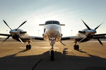 A C-12 awaiting cargo from the Defense Courier Station Offutt is parked on the flightline at Offutt Air Force Base, Neb., Nov. 18, 2014. After loading, the aircraft will make several daily deliveries throughout the Midwest.  (U.S. Air Force photo by Josh Plueger/Released)