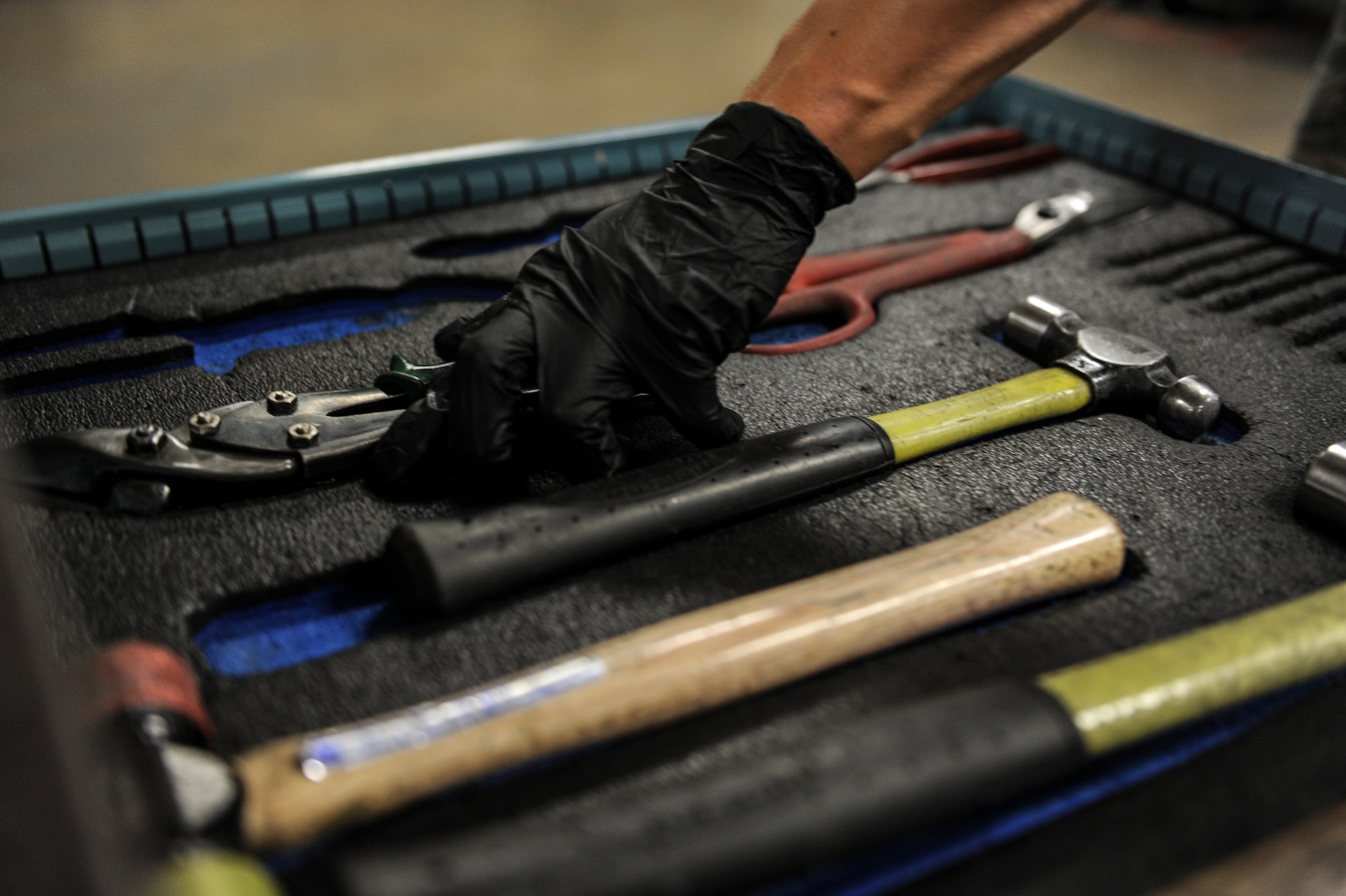 Senior Airman Johnathon Pulsifer, a 19th Maintenance Squadron aircraft structural maintainer, removes a set of vice grips from his toolbox Nov. 25, 2014, at Little Rock Air Force Base, Ark. Metal’s maintainers fulfill dozens of work orders a week ensuring Team Little Rocks C-130’s are mission ready. (U.S. Air Force photo by Senior Airman Cliffton Dolezal)  