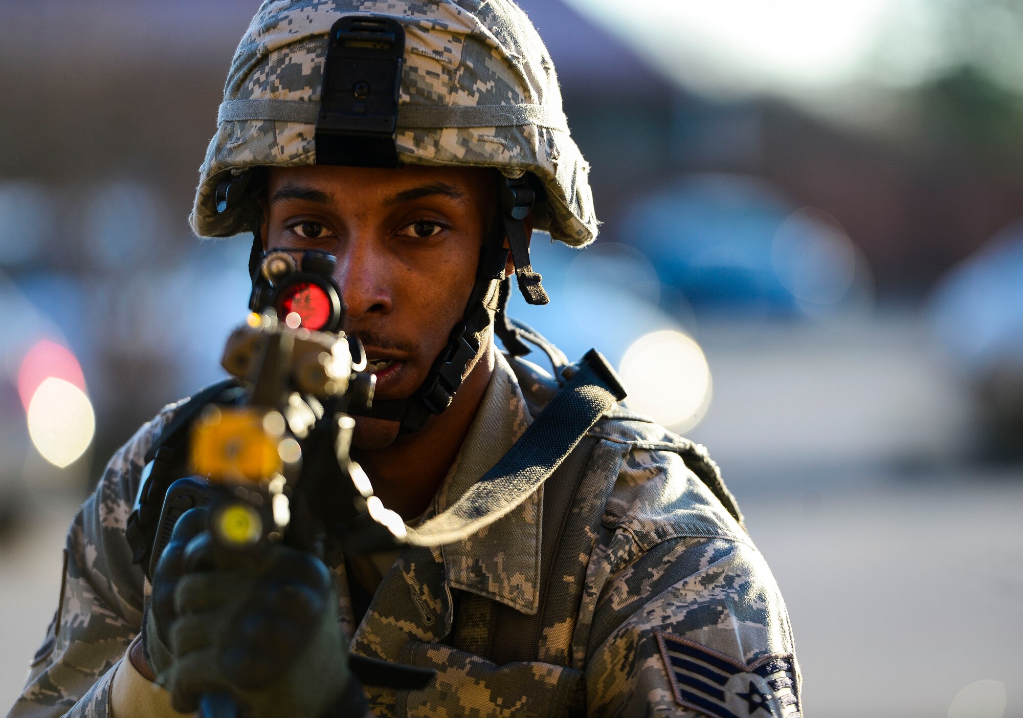 U.S. Air Force Staff Sgt. Richard Clark, 633rd Security Forces base defense operations center controller, responds to an active shooter during an exercise at Langley Air Force Base, Va., Dec. 11, 2014. The exercise was initiated with SFS receiving a call of an active shooter at the Shellbank Fitness Center, in which point an eight-Airmen fire team assembled and responded.  (U.S. Air Force photo by Senior Airman Kayla Newman/Released)
