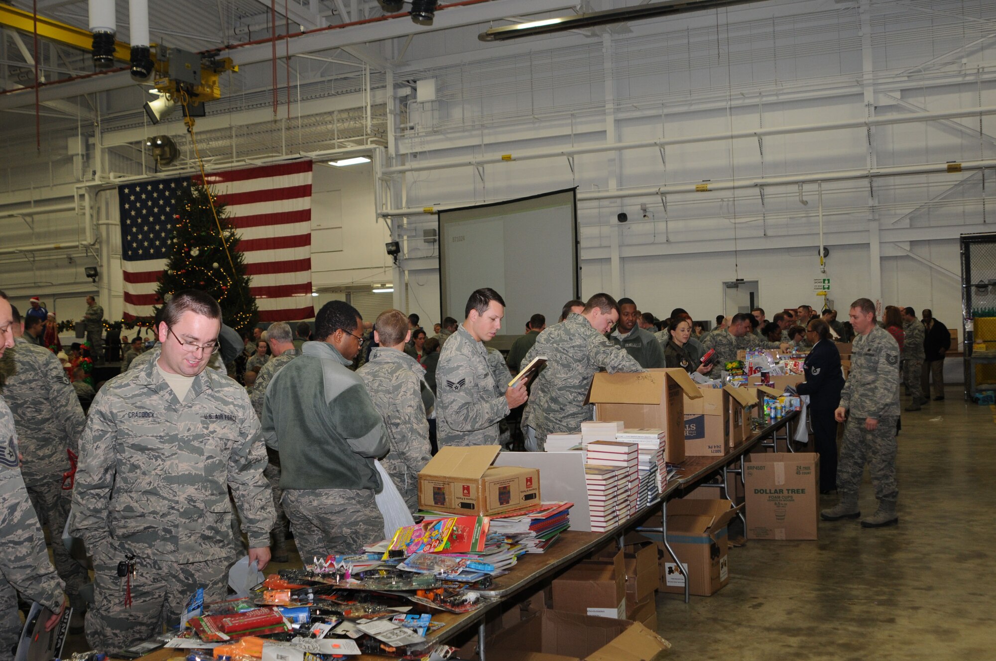 YOUNGSTOWN AIR RESERVE STATION, Ohio – Members of the Air Force Reserve’s 910th Airlift Wing peruse donations of food and gifts provided by the USO of Northern Ohio during the holiday party here Dec. 6, 2014. The holiday party is a long standing annual 910th Airlift Wing tradition. U.S. Air Force photo/Tech. Sgt. Rick Lisum 