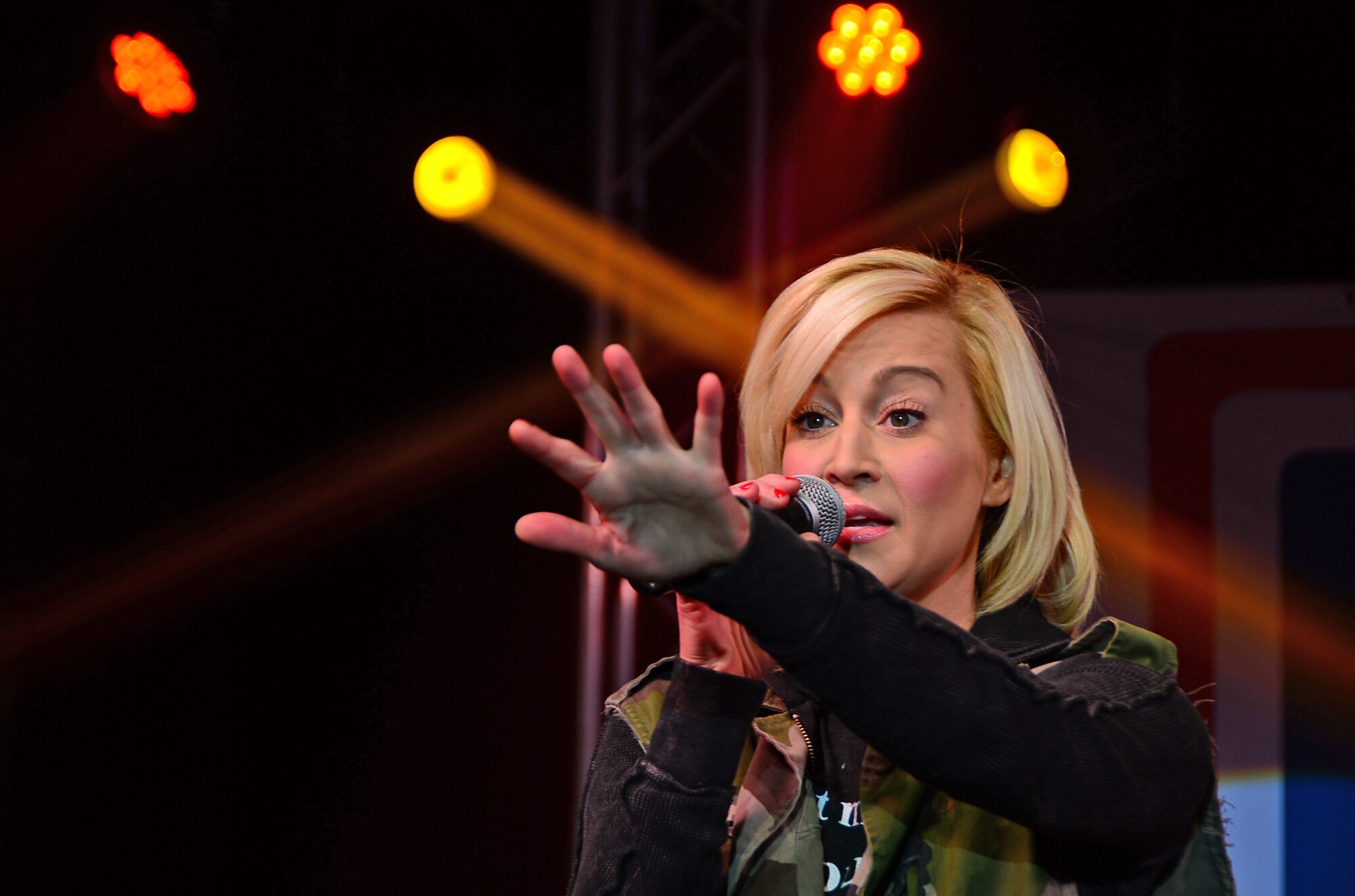 Kellie Pickler, country music artist, sings during a USO Holiday Troop Visit at Royal Air Force Mildenhall, England, Dec. 10, 2014. This was Pickler’s eighth USO tour. (U.S. Air Force photo by Senior Airman Erin O’Shea/Released)