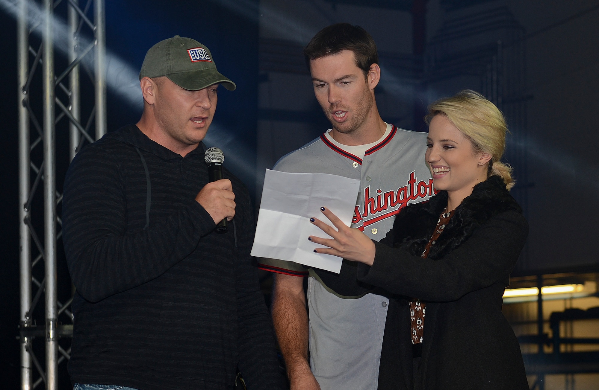 Brian Urlacher, former Chicago Bears linebacker, and Doug Fister, Washington Nationals pitcher, sing ‘Let It Go’ from the Disney movie, Frozen, during a USO Holiday Troop Visit at Royal Air Force Mildenhall, England, Dec. 10, 2014. This show was part of a USO tradition to partner with senior leaders and celebrity entertainers to visit troops serving abroad during the holiday season.  (U.S. Air Force photo by Airman 1st Class Trevor T. McBride/Released)