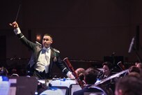 Captain Rafael Toro-Quinones, U.S. Air Force Band of the West Concert Band commander, conducts holiday classics during the annual Holiday in Blue Concert Dec. 6 at the Edgewood Theatre of Performing Arts in San Antonio, Texas. The Band of the West is composed of a 60-member squadron comprised of nine different musical configurations. The band executes more than 300 annual musical productions and is responsible for a seven state, 580,000 square mile region. (U.S. Air Force photo by Master Sgt. Sean M. Worrell)