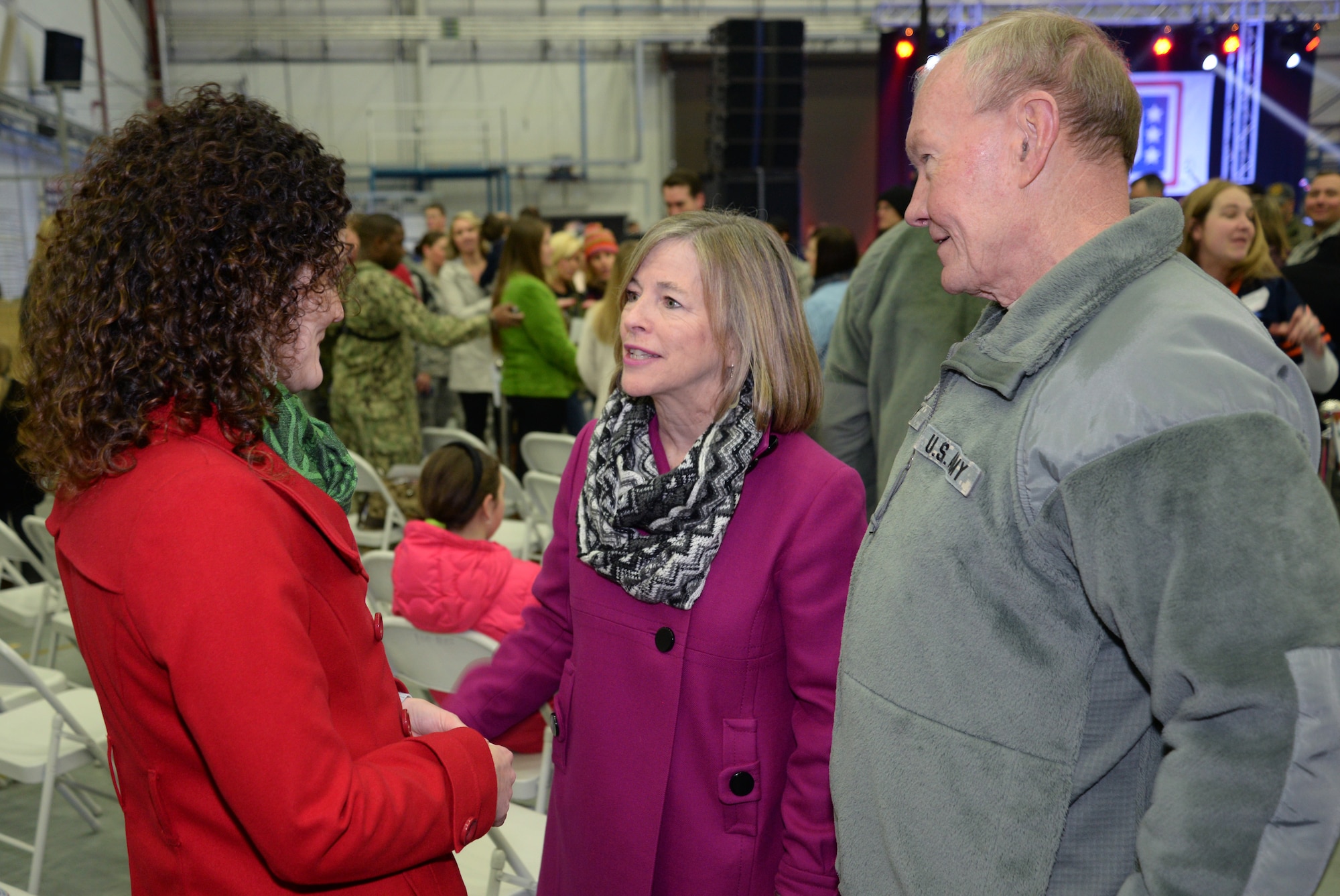 U.S. Army Gen. Martin E. Dempsey, Chairman of the Joint Chiefs of Staff, right, and his wife Deanie, speak with a Team Mildenhall member during a USO holiday tour meet and greet Dec. 10, 2014, on RAF Mildenhall, England. Dempsey, along with a group of celebrities, visited the base and met service members from both RAF Mildenhall and RAF Lakenheath along with their families. (U.S. Air Force photo by Airman 1st Class Dillon Johnston/Released)