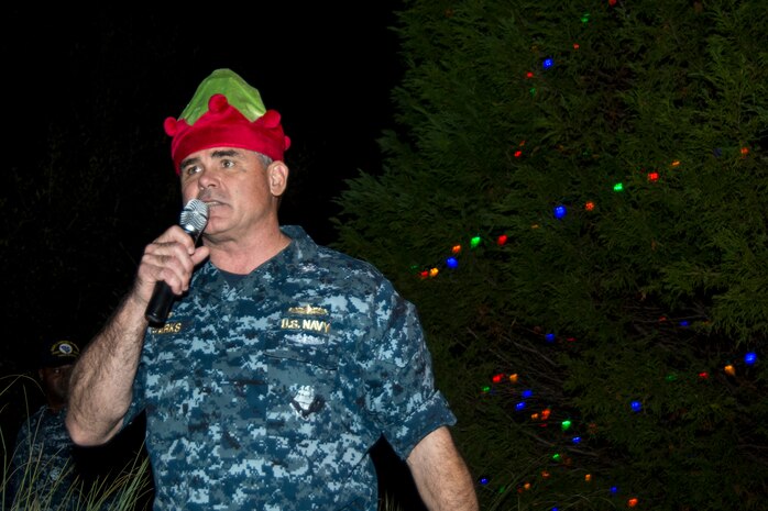U.S. Navy Capt. Timothy Sparks, Joint Base Charleston deputy commander, conveys his holiday greetings during the annual Christmas tree lighting ceremony Dec. 4, 2014, on Joint Base Charleston - Weapons Station, S.C. The tree lighting is an annual tradition held at both the Air Base and Weapons Station to kick off the holiday season. (U.S. Air Force photo/Senior Airman Melissa Goslin)