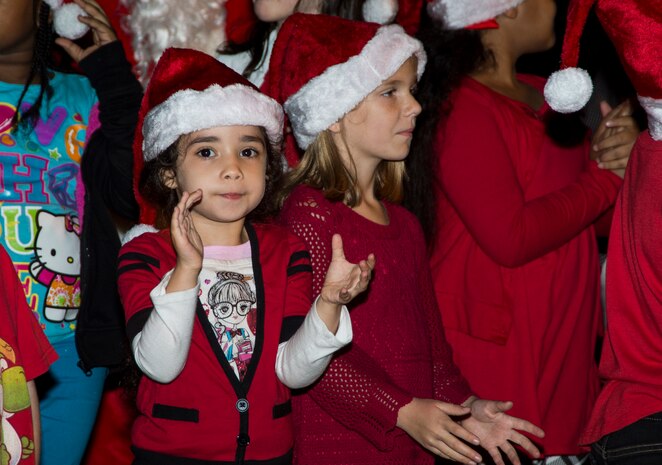 Children from the Joint Base Charleston Youth Center sing Christmas carols during the annual Christmas tree lighting ceremony Dec. 4, 2014, on JB Charleston - Weapons Station, S.C. The tree lighting is an annual tradition held at both the Air Base and Weapons Station to kick off the holiday season. (U.S. Air Force photo/Senior Airman Melissa Goslin)