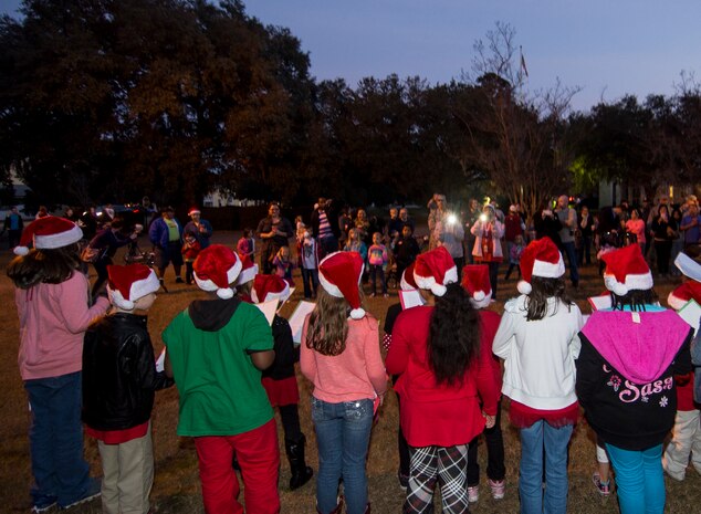 Children from the Joint Base Charleston Youth Center sing Christmas carols during the annual tree lighting ceremony Dec. 4, 2014, on Joint Base Charleston - Weapons Station, S.C. The tree lighting is an annual tradition held at both the Air Base and Weapons Station to kick off the holiday season. (U.S. Air Force photo/Senior Airman Melissa Goslin)