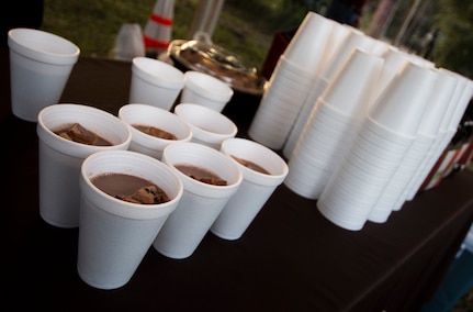 Steaming cups of hot chocolate are ready to be handed out to Sailors, Airmen and their families at the annual Christmas tree lighting ceremony Dec. 4, 2014, on Joint Base Charleston - Weapons Station, S.C. The tree lighting is an annual tradition held at both the Air Base and Weapons Station to kick off the holiday season. (U.S. Air Force photo/Senior Airman Melissa Goslin)